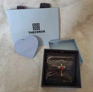 Theceros .925 Sterling Ruby Cross with angel wings necklace